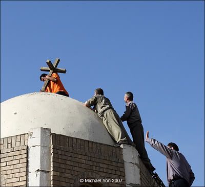 Photo By Michael Yon - Christians and Muslims raising cross on Iraqi church